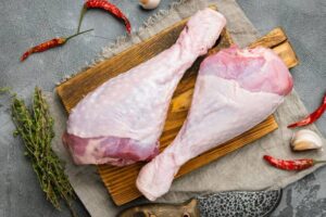 Drumstick turkey meat raw with ingredients set, on gray stone table background